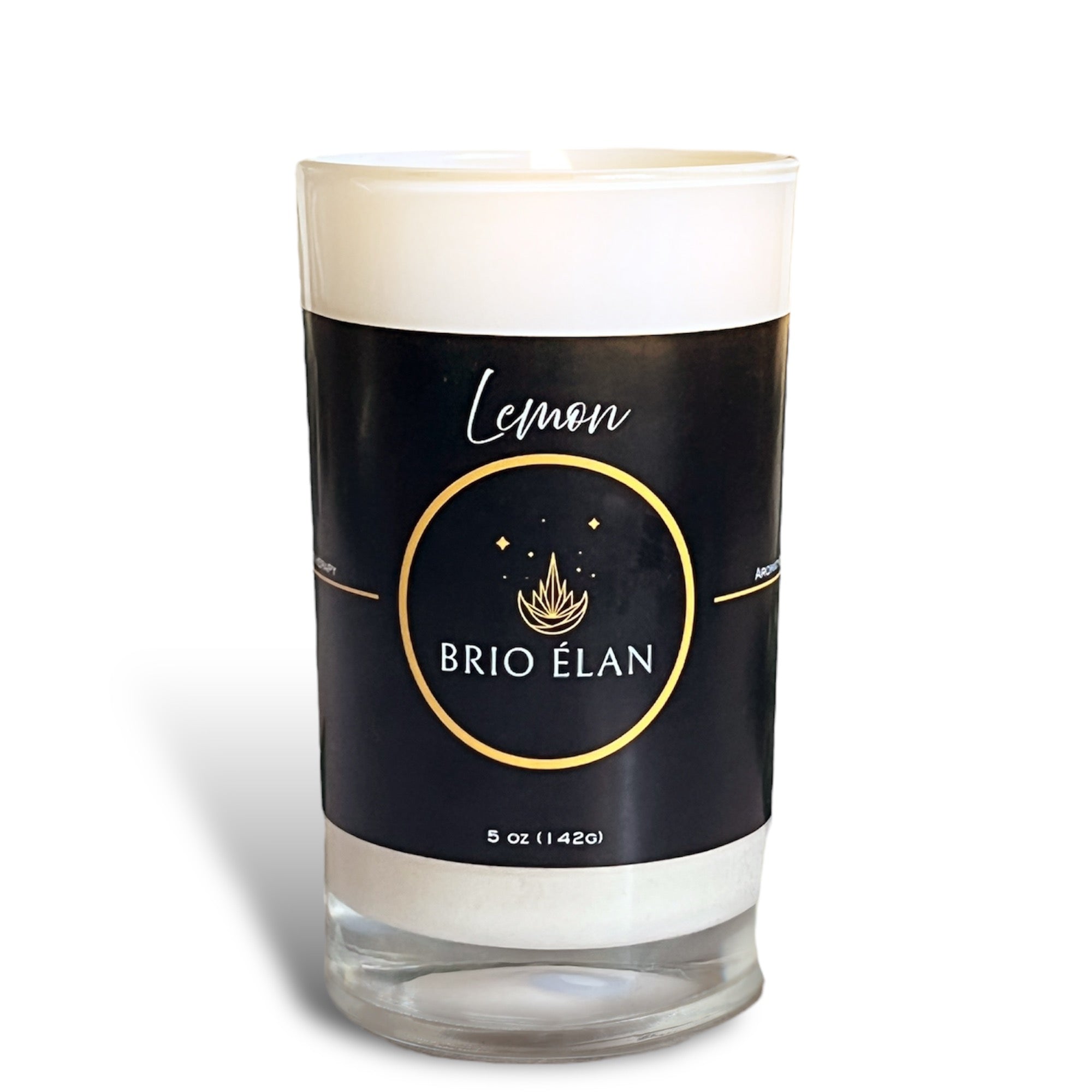 A white candle with a black label that reads 'Lemon BRIO ELAN', indicating the scent of lavender and the brand name with a white background.
