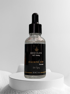 A clear glass bottle with a dropper containing Hyaluronic Acid Facial Serum, labeled BRIO ÉLAN. The bottle is presented on a white platform with a white background.