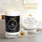 A white candle with a black label that reads 'Lemon BRIO ELAN', brand name.